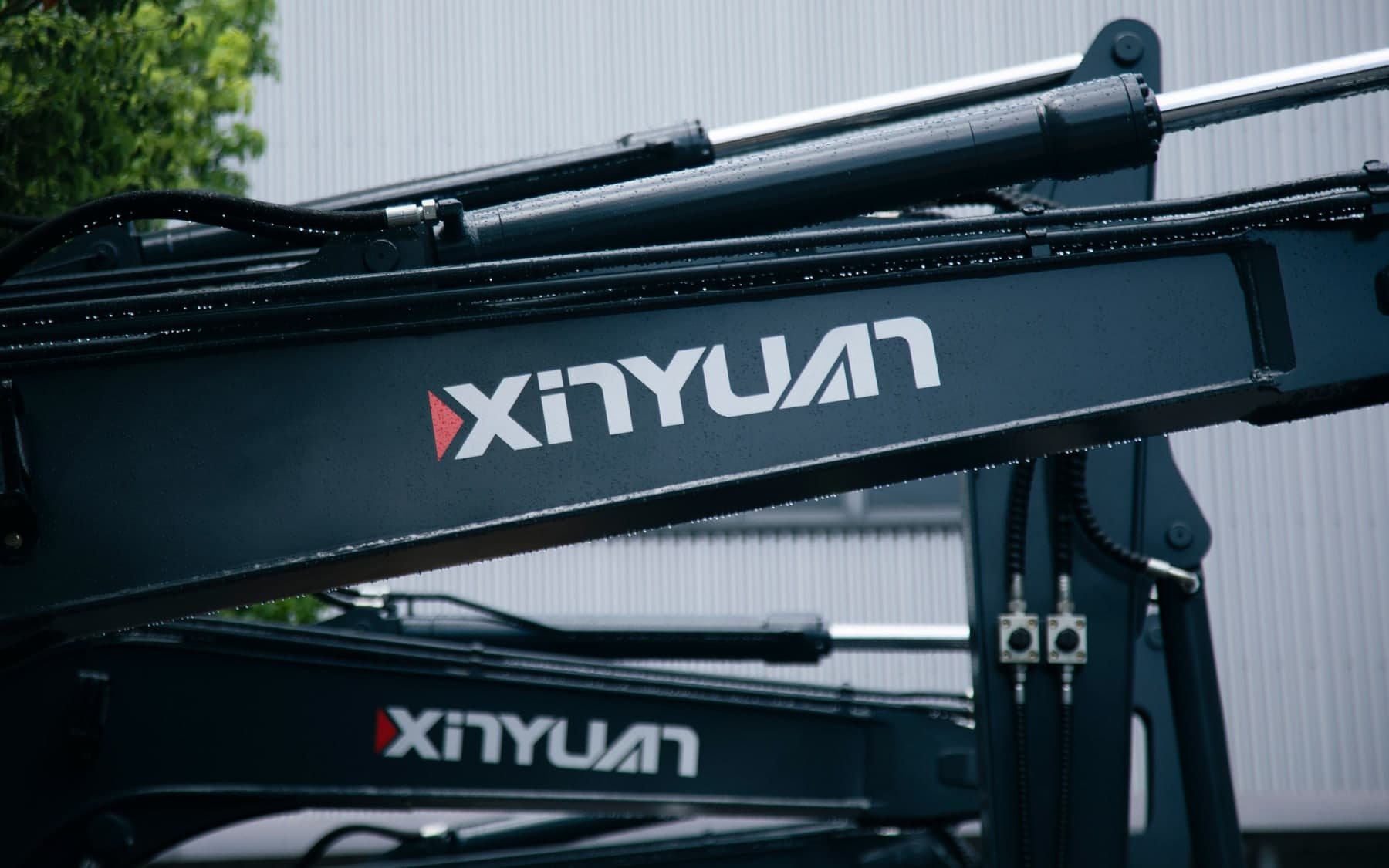 XINYUAN branding on an excavator boom